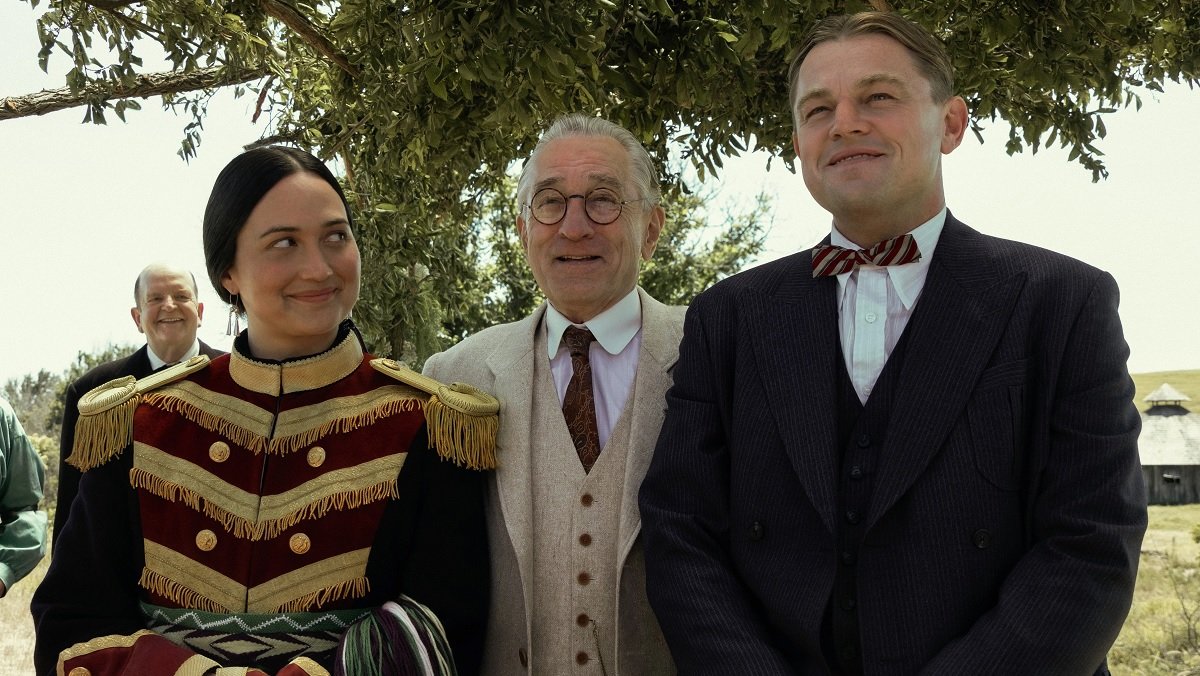 Lily Gladstone, Robert DeNiro and Leonardo DiCaprio in Killers of the Flower Moon.